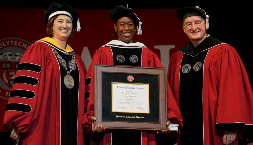 Margot Lee Shetterly, center, author of the bestselling book Hidden Figures and speaker for Worcester Polytechnic Institute’s 2018 Undergraduate Commencement, with WPI President Laurie Leshin and Jack T. Mollen, chair of the WPI Board of Trustees. Shetter