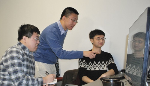 WPI professor Yanhua Li (center) with PhD students 
