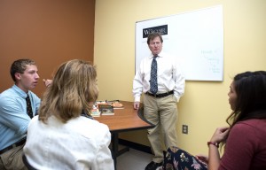 Professor James Dempsey holds a discussion with young writers at the Bancroft School, where Dempsey is serving as writer-in-residence.