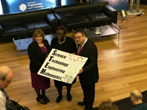 Suzanne Sontgerath on stage with Employment and Learning Minister Stephen Farry and Yvonne Spicer of the Boston Museum of Science.
