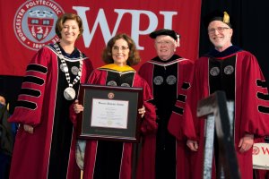 Córdova with, from left, President Leshin, Chairman Ryan, and Provost Bruce Bursten, received an honorary doctor of science degree.
