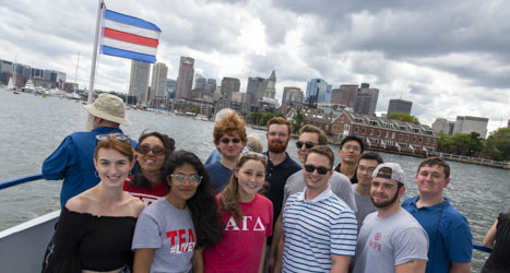 Group of students on boat tour around Boston Harbor.