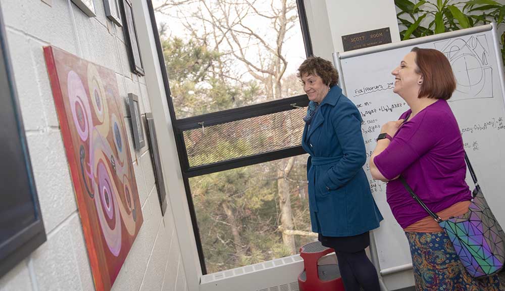 Visitors check out artwork at the annual ART | WPI show.
