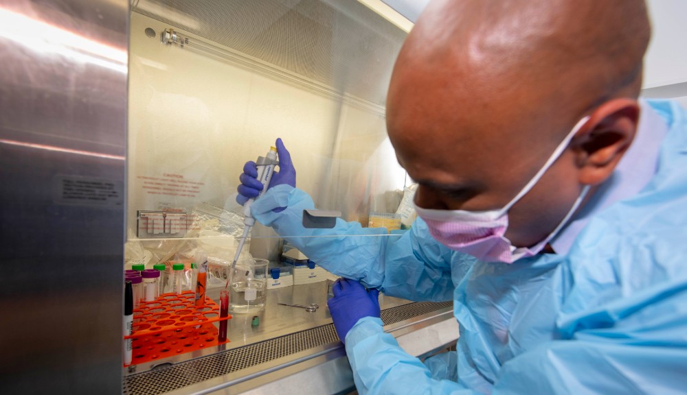 Balaji Panchapakesan at work in the lab on his team liquid biopsy chip.