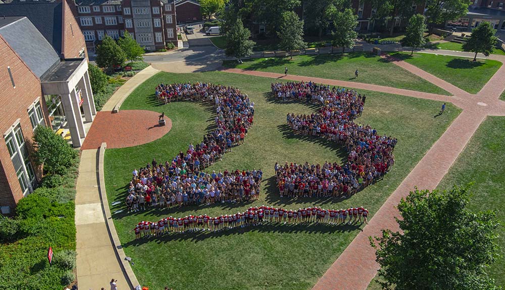 The entire Class of 2023 arranges themselves in a giant "23" on the Quad.