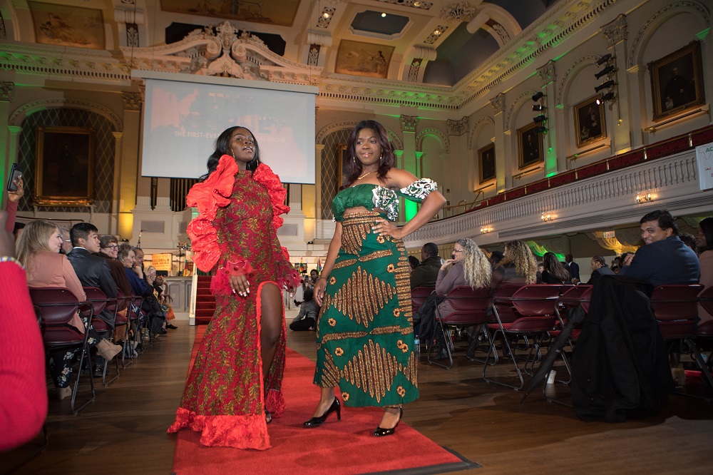 WPI students, from left,  BSU president Mbolle Akume '20, and BSU vice president Rejoice Attor '21, at the end of the runway during the fashion show.