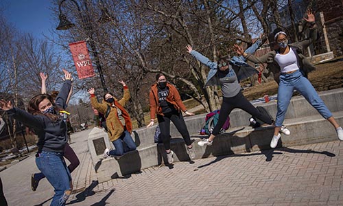 WPI students jumping up and down