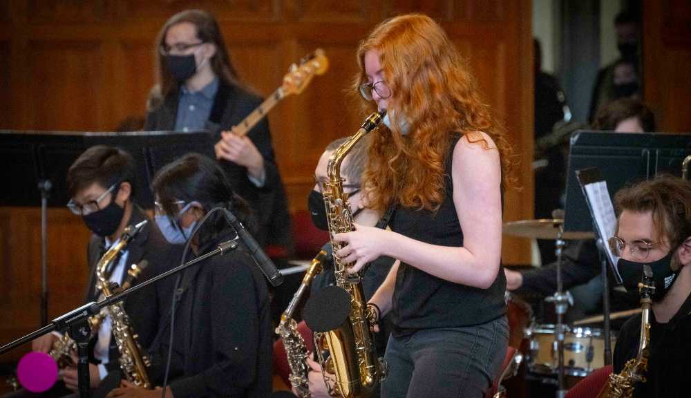 A student plays the saxophone during a performance as part of Arts & Sciences Week.