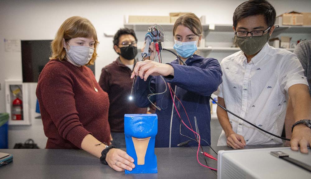 Students demonstrate an innovative instrument that aims to ensure a less invasive larynx surgery.