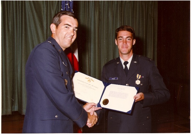 Second Lieutenant Steve Taylor accepts an award in uniform