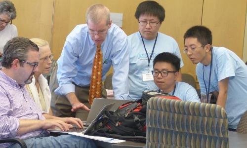 Professor and students working
