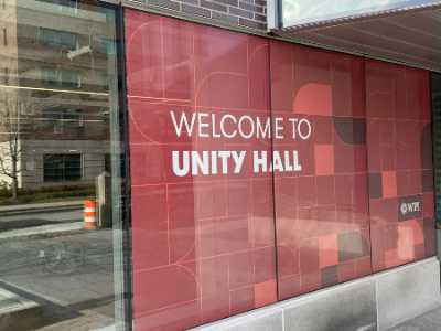 A close-up photo of the sign for Unity Hall.