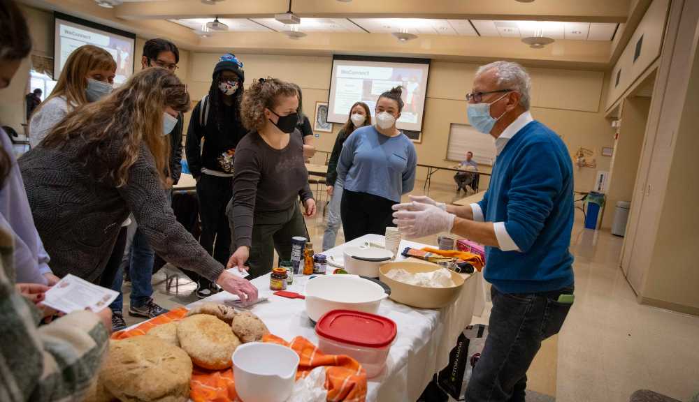 Professor Tahar El-Korchi hosts a breadmaking demonstration in the Odeum.
