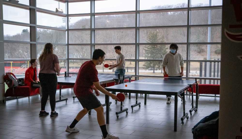 Students play ping pong in the Sports & Recreation Center.