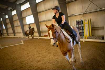 A member of the WPI Equestrian Team rides her horse during a practice.