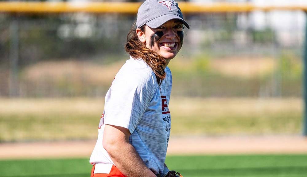 Lindsay Ambrosino smiles on the softball field.
