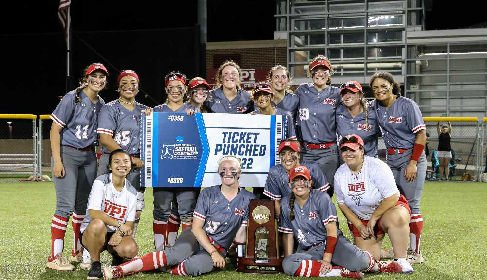 The softball team gathers for a photo on Rooftop Field after earning their NCAA berth.