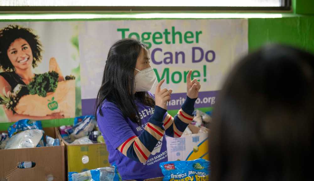 A student discusses some information with her project teammates.