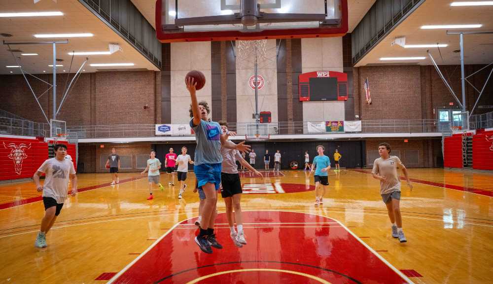 Students participate in a basketball camp in Harrington Auditorium.