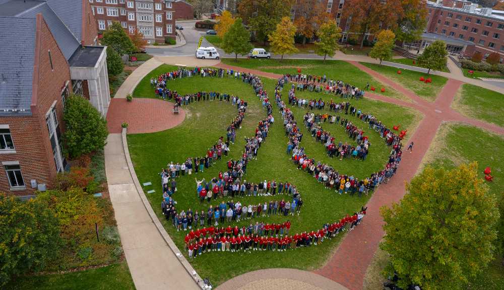An aerial photo of the Class of 2026 spelling out "26" on the Quad.