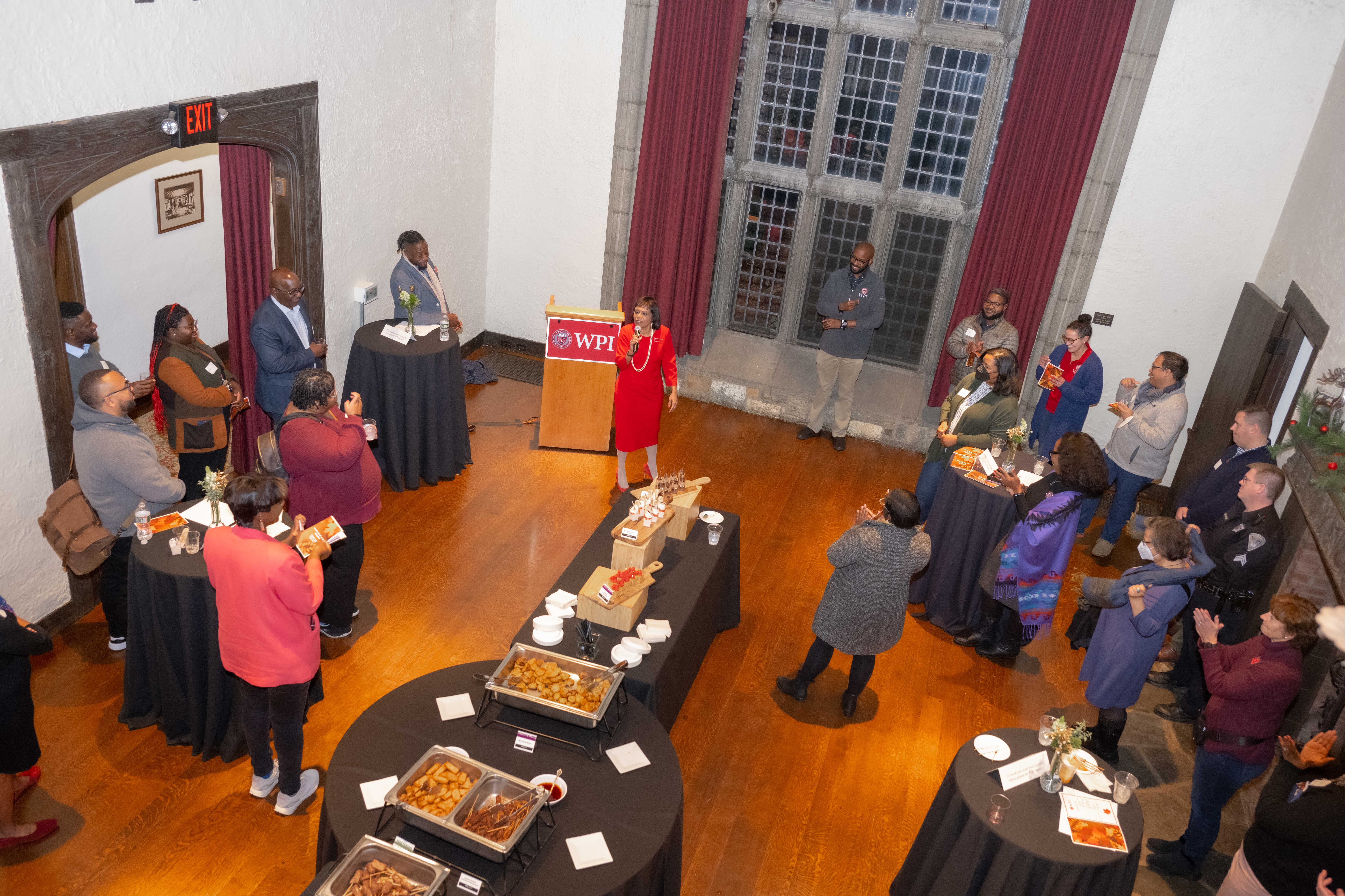 Faculty and staff gather for conversation.
