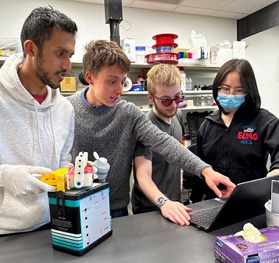 Students work on a prototype device.