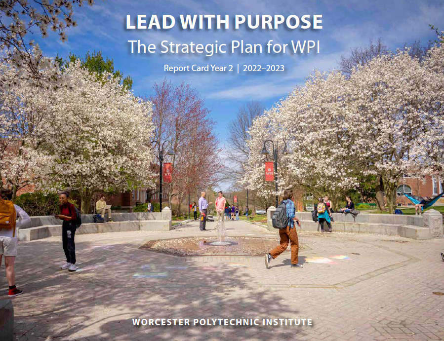WPI's Freeman Plaza with trees in bloom and students walking by