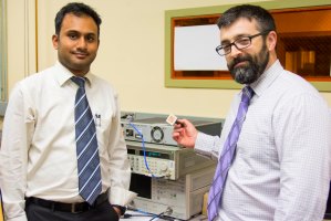 Researchers Yanamadala (left) and Noetscher with an antenna that could be used to treat tumors
