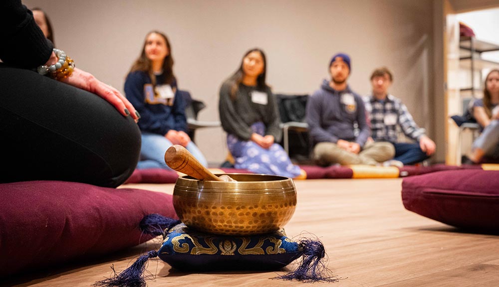 Students participate in a meditation class in the Center for Well-Being.