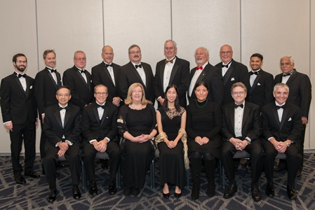 Lados (seated, third from right) with other members of the ASM board of directors in a photo taken during Materials Science &amp; Technology 2018.