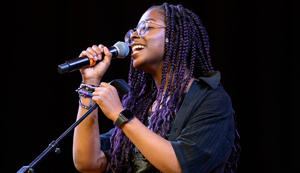 A student sings during the community talent show.