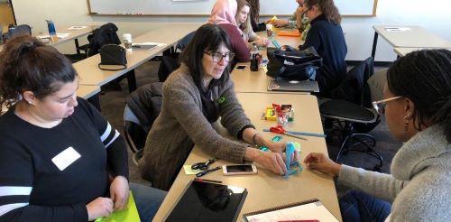 people working on a project together at a table