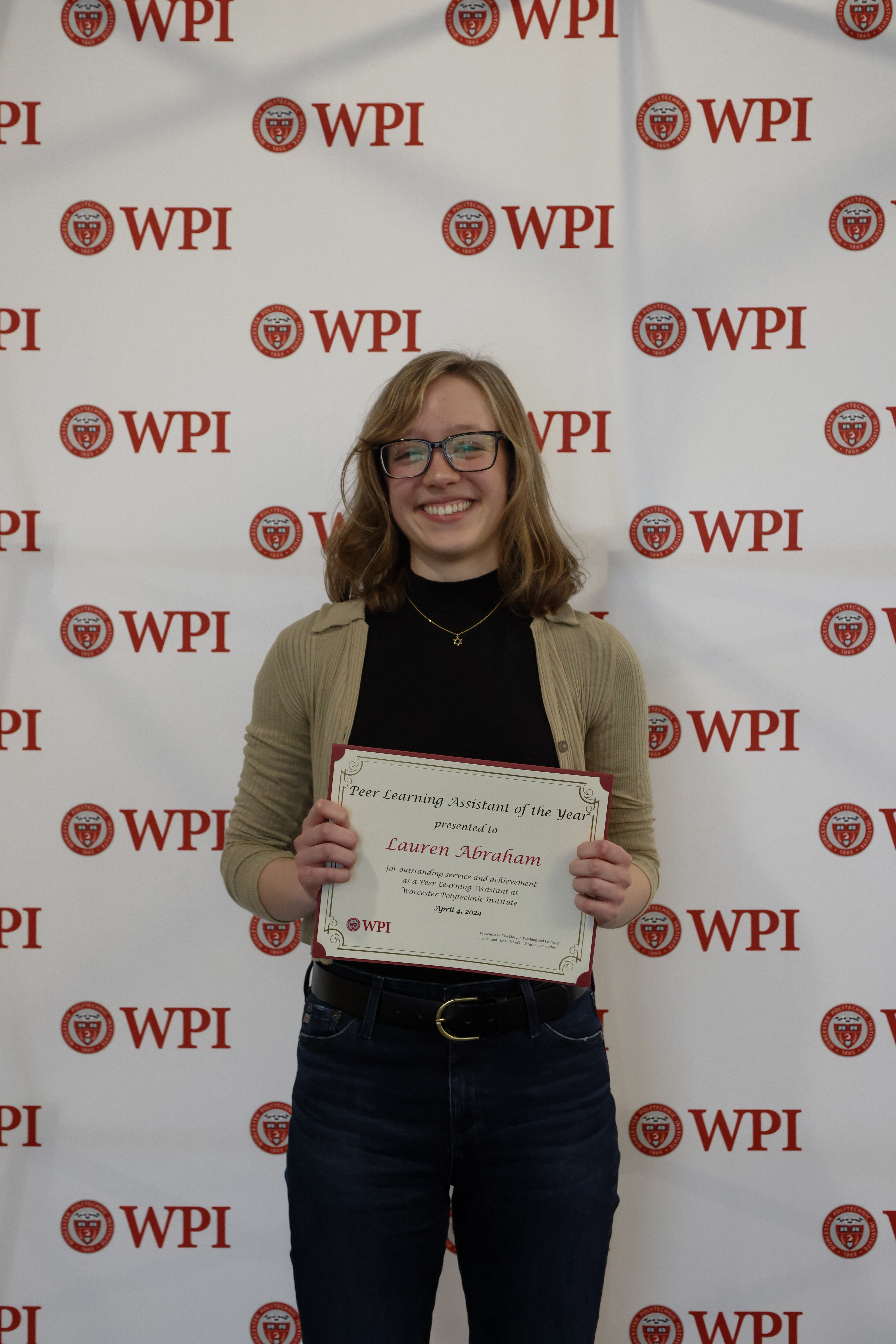 Lauren Abraham holding PLA of the Year Award