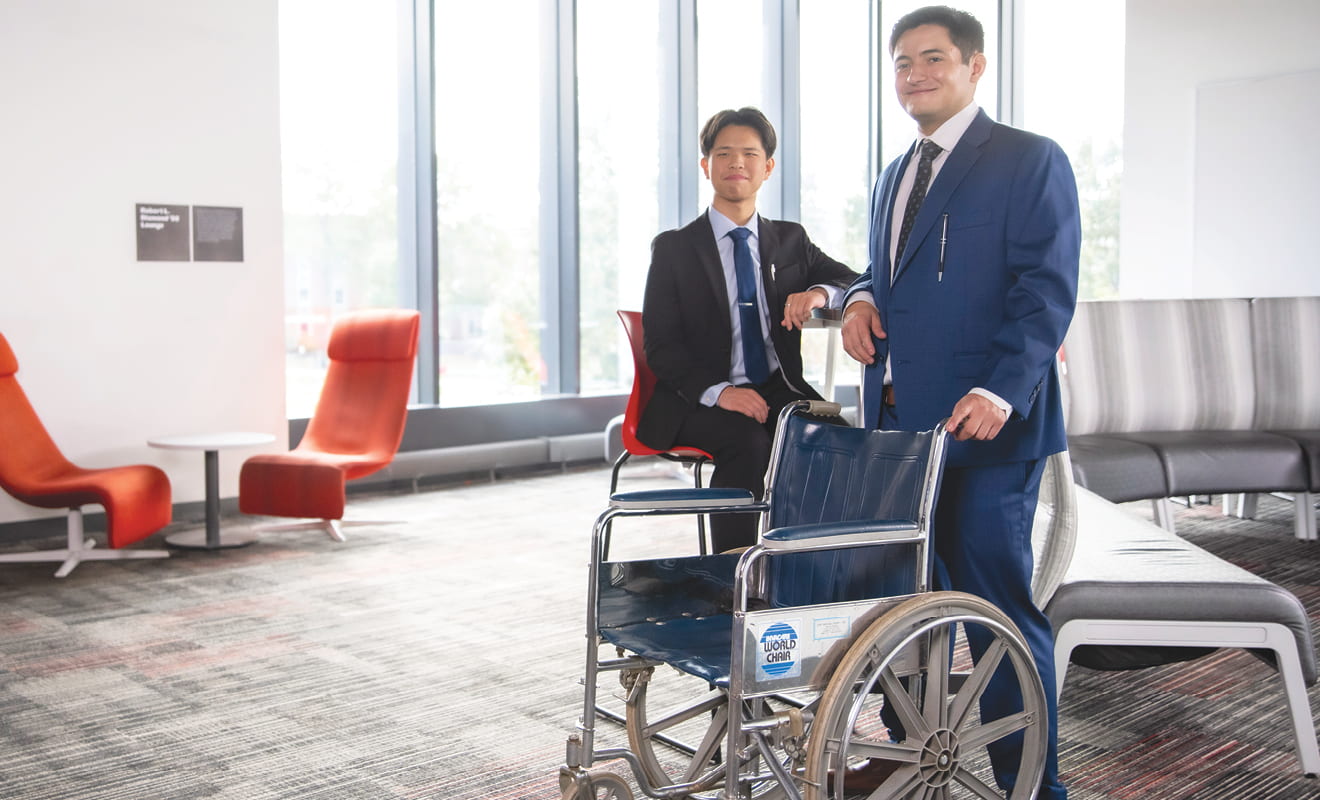 two men with wheelchair