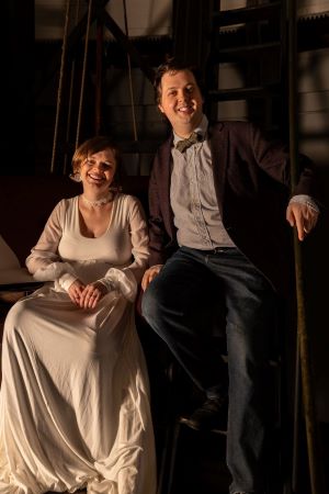 David Ibbett standing to the right of a seated Agnes Cox