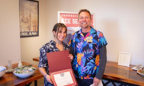 WPI ECE student Olivia Kendzulak and faculty member holding award at ECE senior banuqet