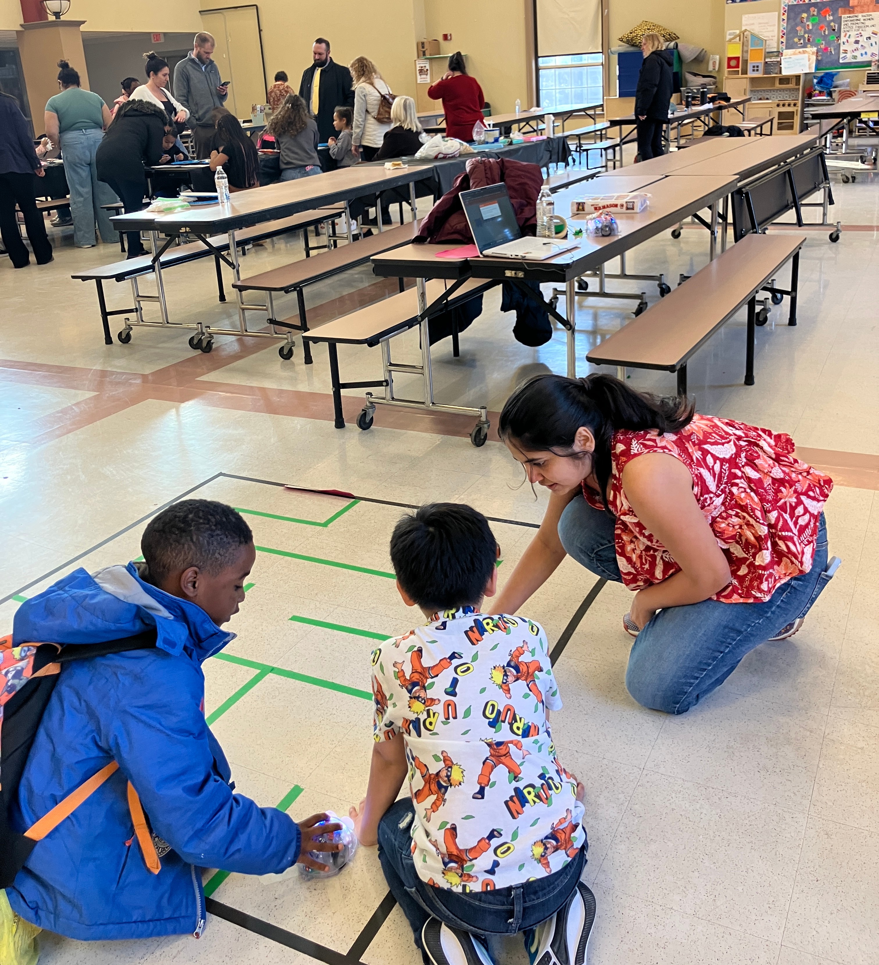 WPI Student Keerthana Cheelamanthula (Right) facilitated Edison Robots at Roosevelt’s Elementary Family STEM Night Event.