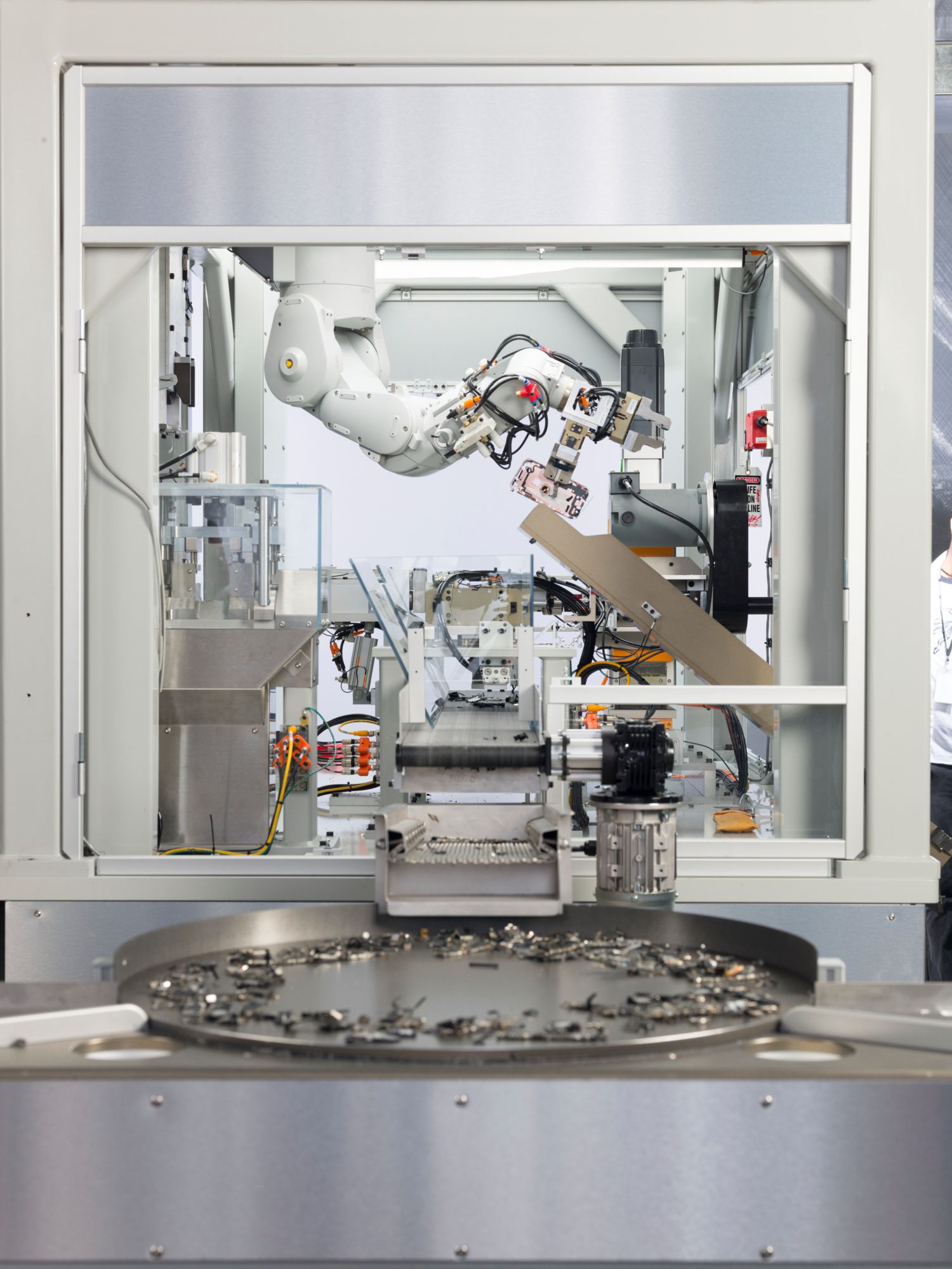 Apple’s disassembly robot Daisy separates critical materials, like gold, copper, lithium batteries, and rare-earth elements, from used devices to be recycled.