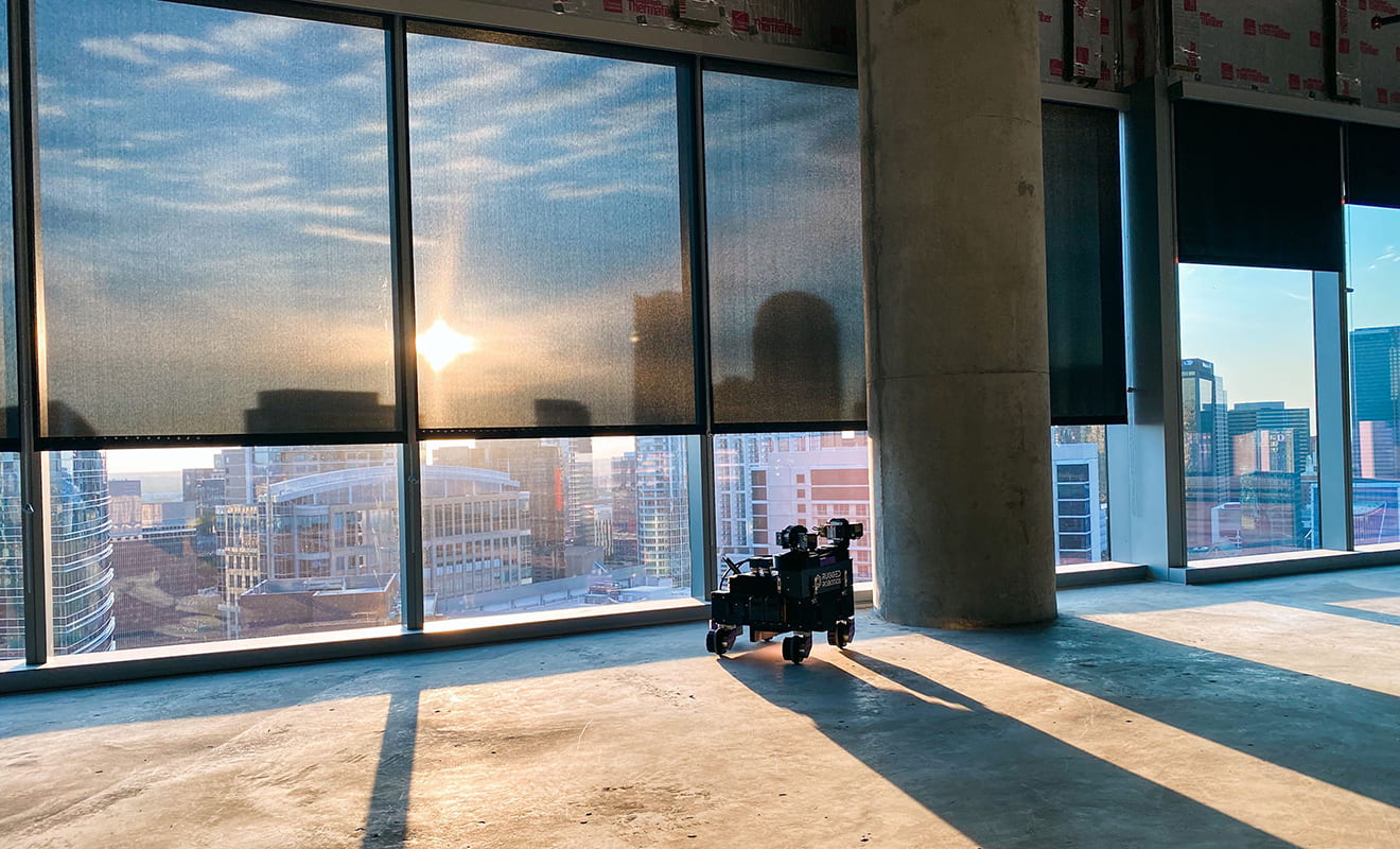 Sunrise outside a skyscraper's windows