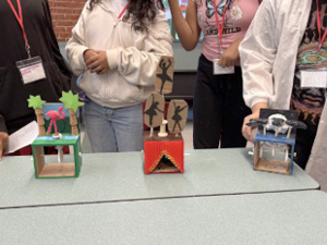 Seventh grade students learning physics concepts and bringing designs to life.
