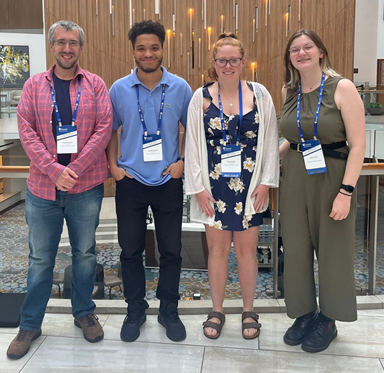 Three student Noyce Scholars and TJ Noviello, WPI Faculty, at the 2025 Noyce Summit in Washington DC.