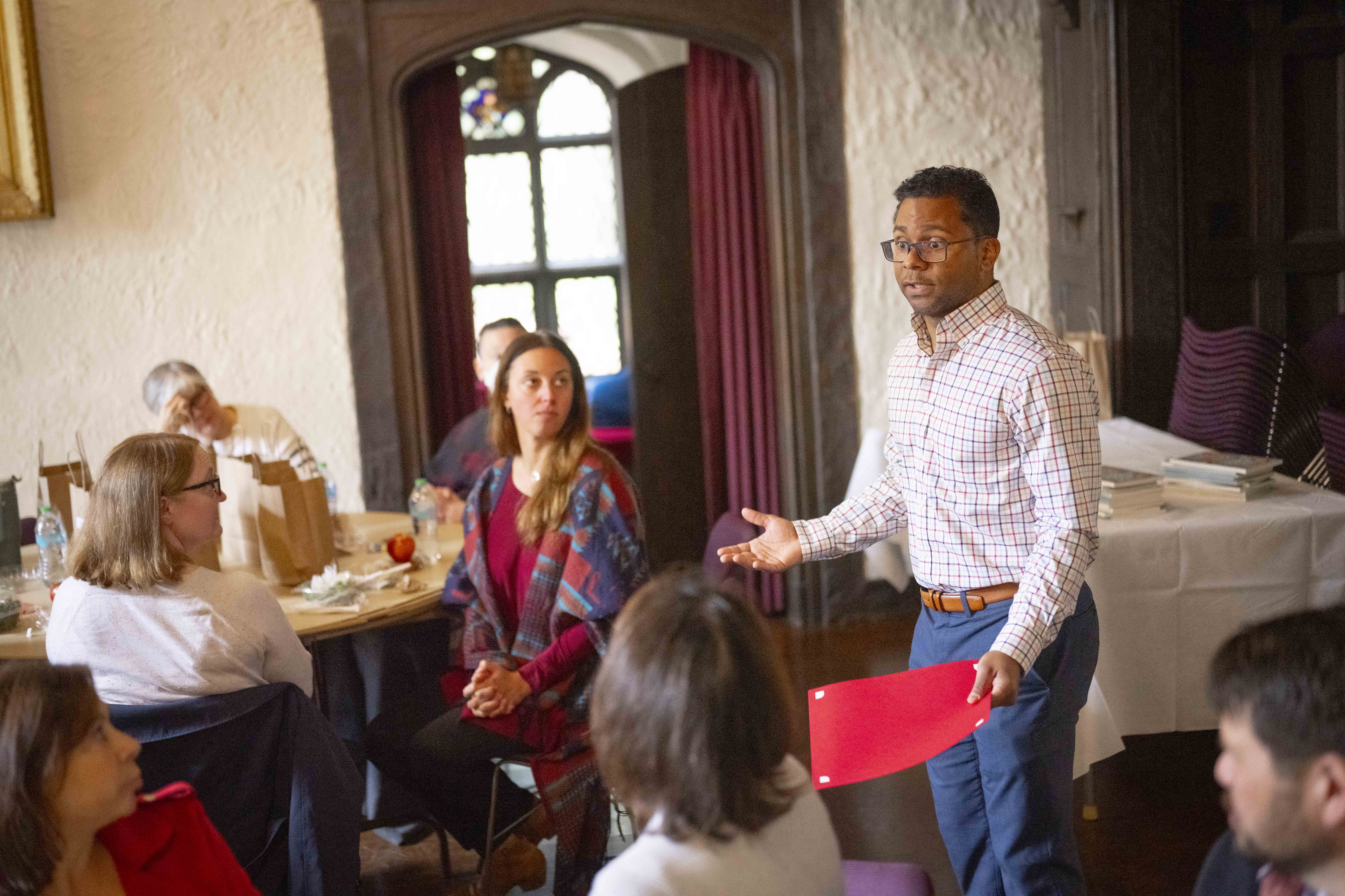 man speaking to a small crowd