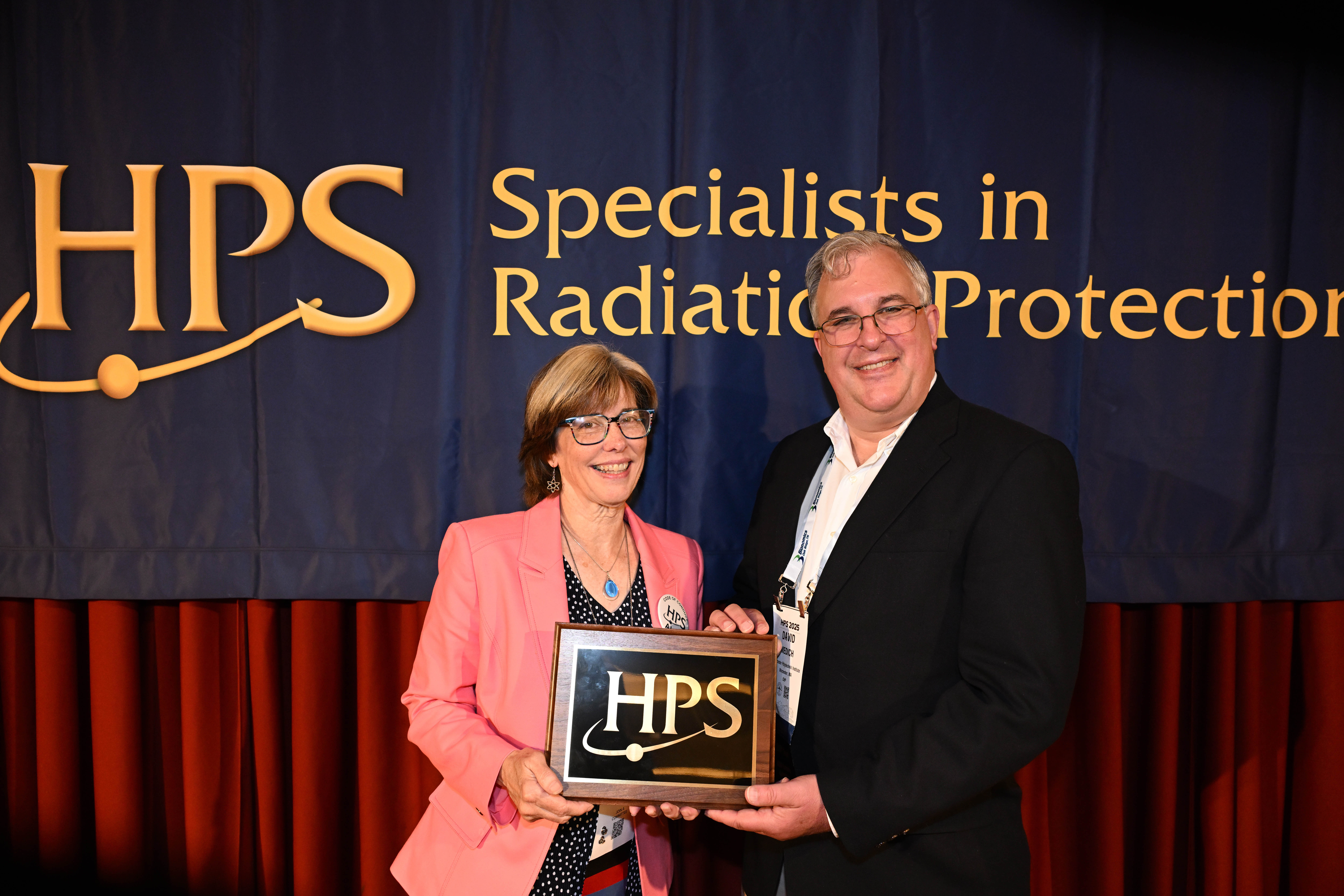 Professor Medich receiving his award by HPS President Liz Brackett
