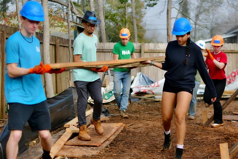 students in construction gear on job site