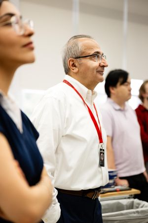 Yagoobi, center, watches a live webcast of the New Shepard launch.