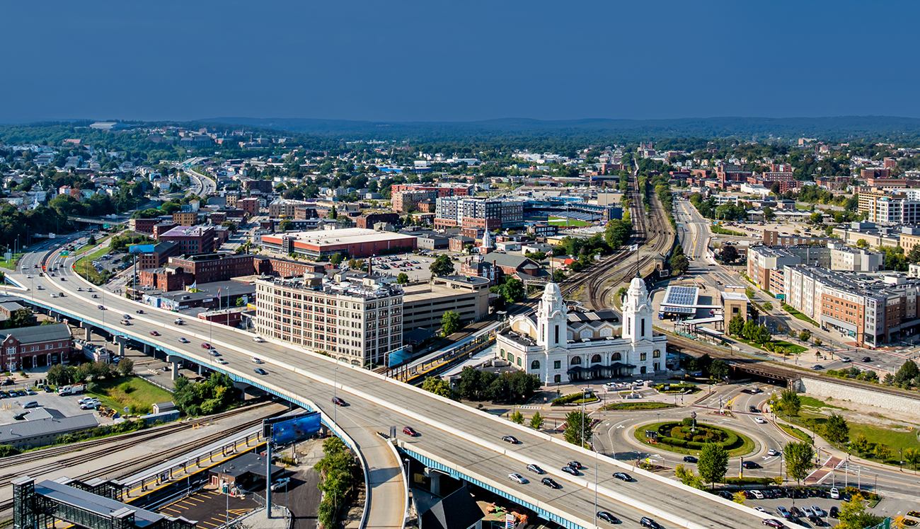 Wide shot of Worcester city focused on buildings, transportation and economic growth
