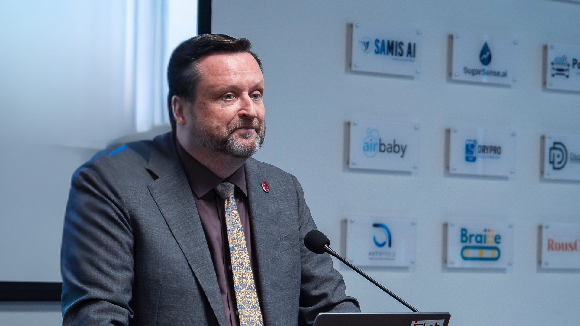 Andrew Sears delivering opening remarks