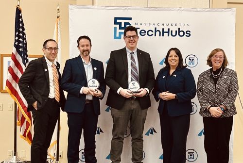 Professor Eric Young with State officials getting BioHub award