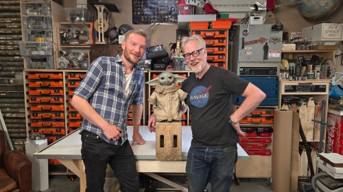 Ralph Sutter standing next to replica of Baby Yoda, and Adam Savage