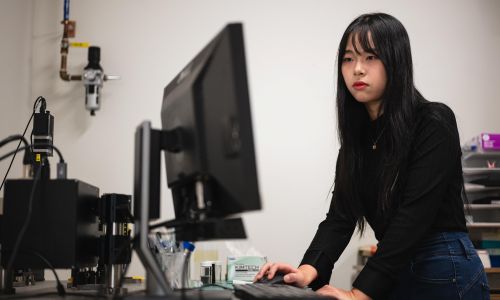 Rao Fu, a PhD student in Ding's lab, works at a computer.